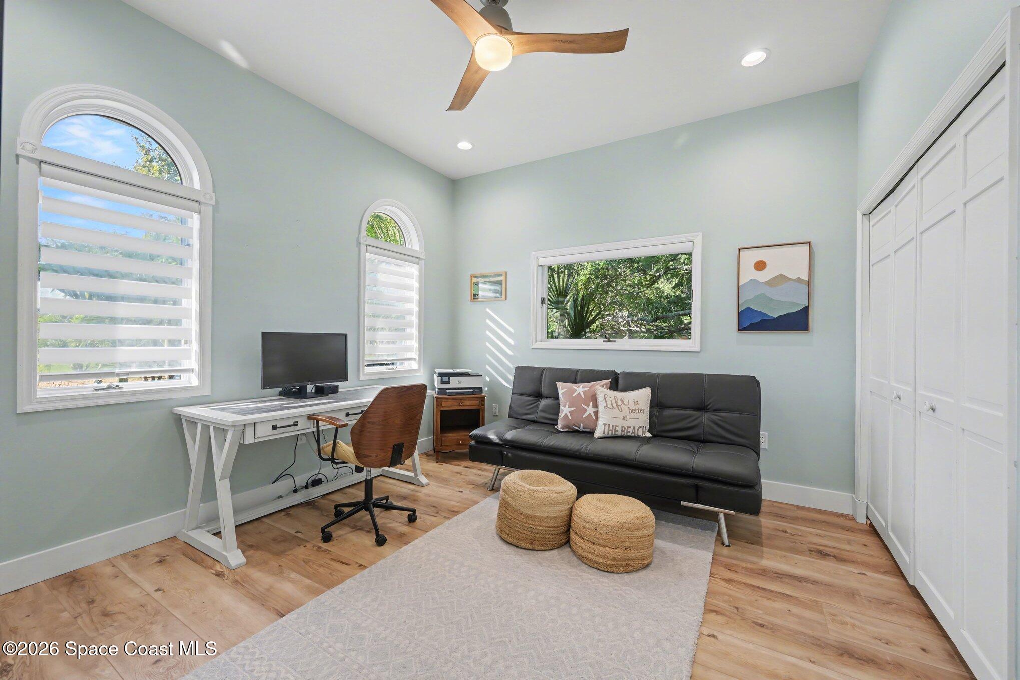 140 Utopia Circle Merritt Island, FL 32952 - Photo 25 of 55 a living room with furniture and a window