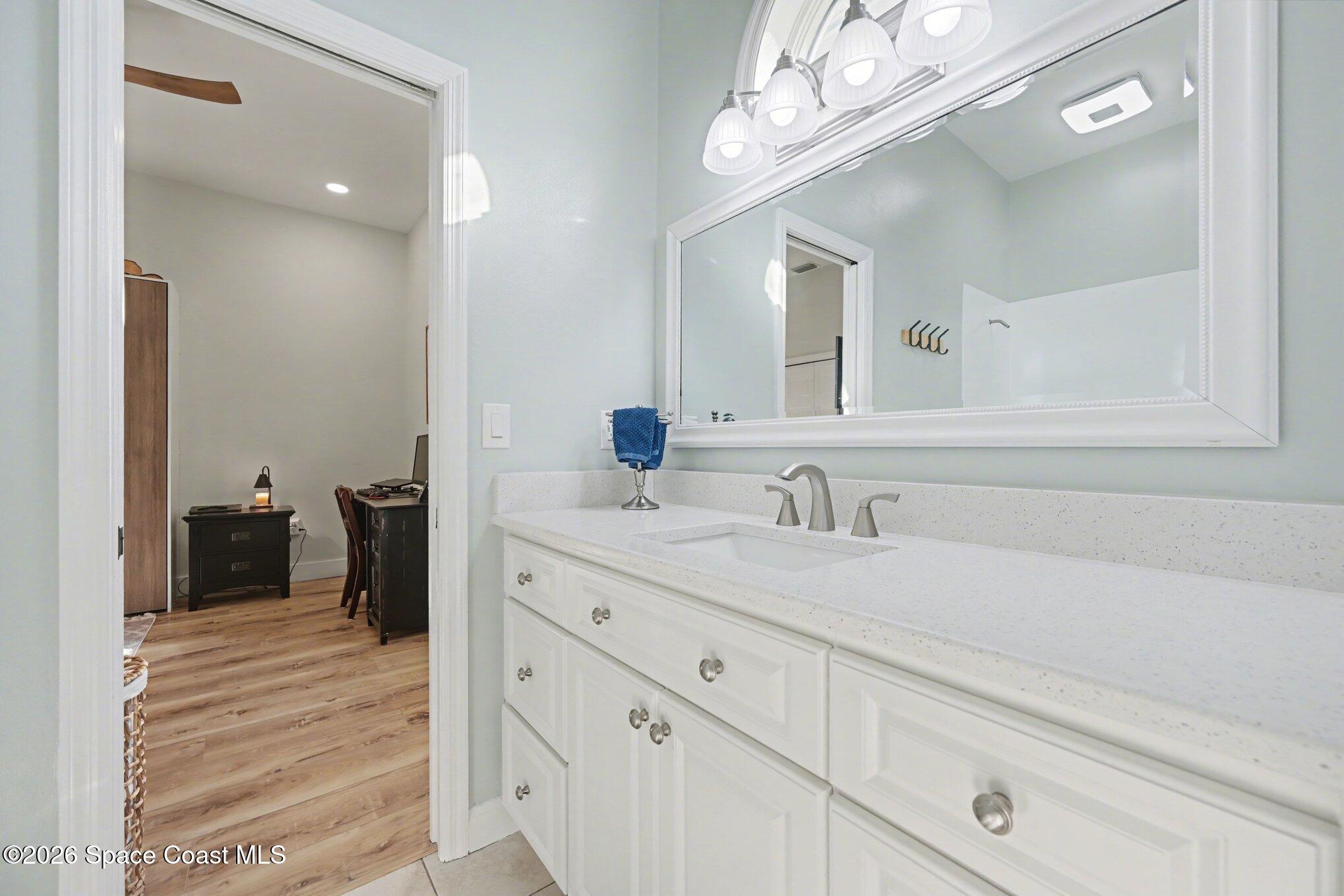 140 Utopia Circle Merritt Island, FL 32952 - Photo 28 of 55 a bathroom with a sink a vanity and a mirror