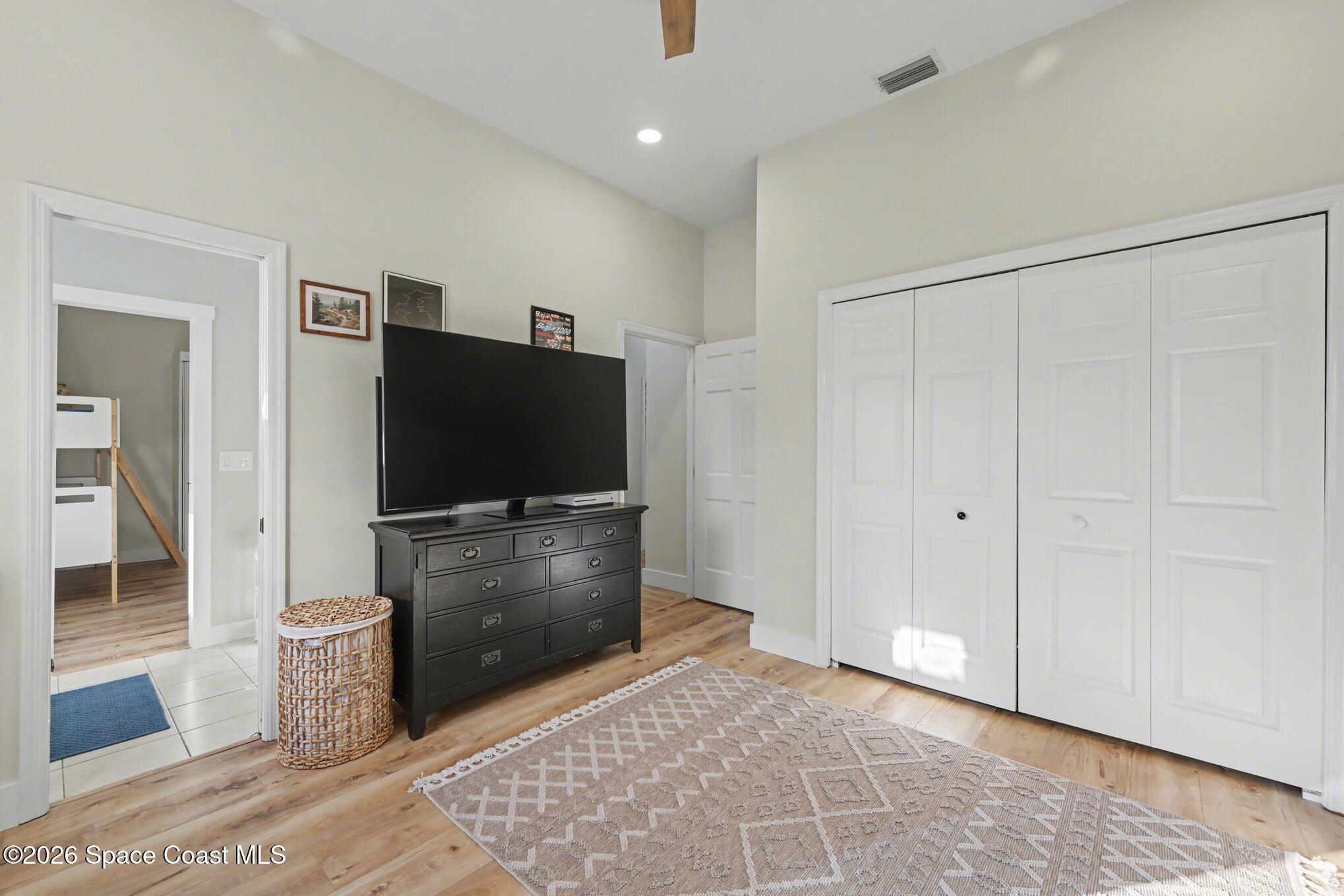 140 Utopia Circle Merritt Island, FL 32952 - Photo 29 of 55 a living room with furniture and a flat screen tv