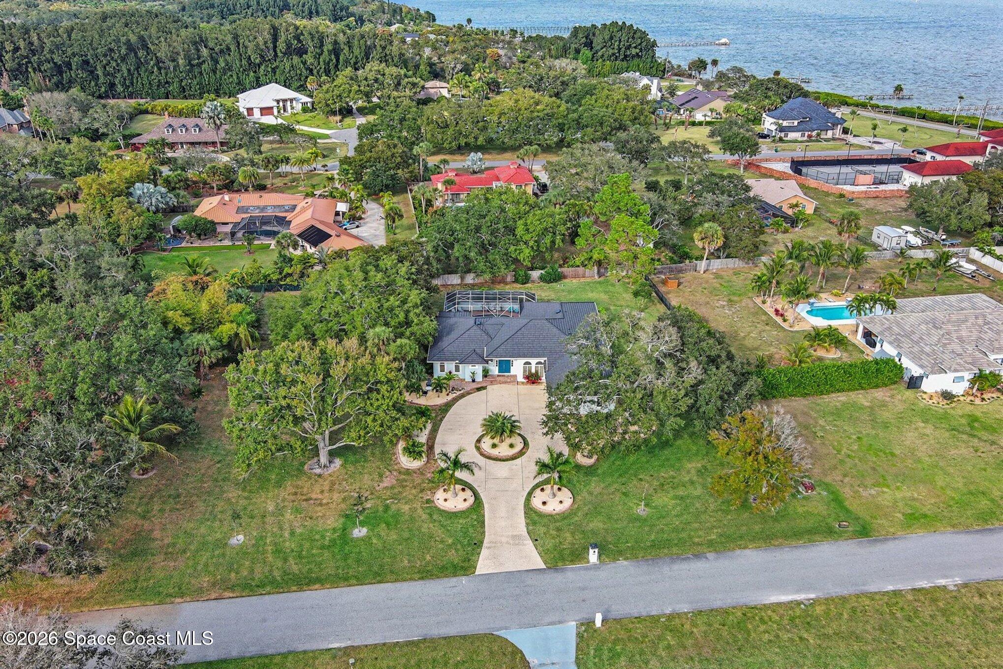 140 Utopia Circle Merritt Island, FL 32952 - Photo 49 of 55 an aerial view of residential house with outdoor space and street view