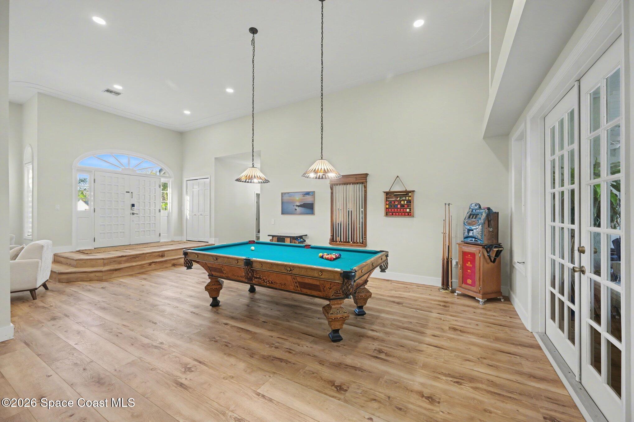 140 Utopia Circle Merritt Island, FL 32952 - Photo 8 of 55 a room with wooden floor and pool table