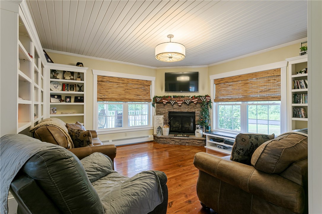 3423 Smallwood Road Warsaw, NY 14569 - Photo 22 of 41 Books movies and a cozy fireplace what a living ro