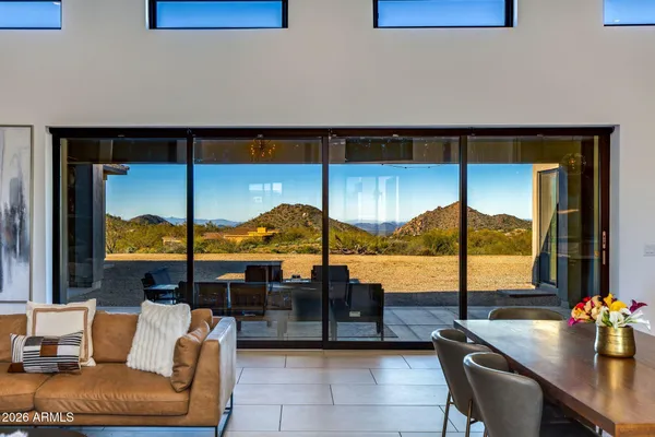 a kitchen with stainless steel appliances granite countertop a sink and a refrigerator