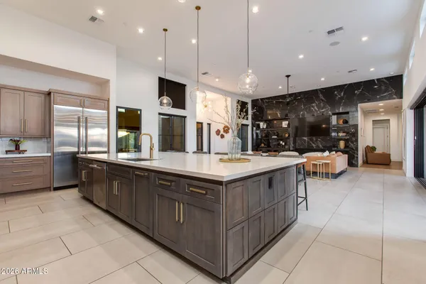 a spacious bathroom with a granite countertop sink and a mirror