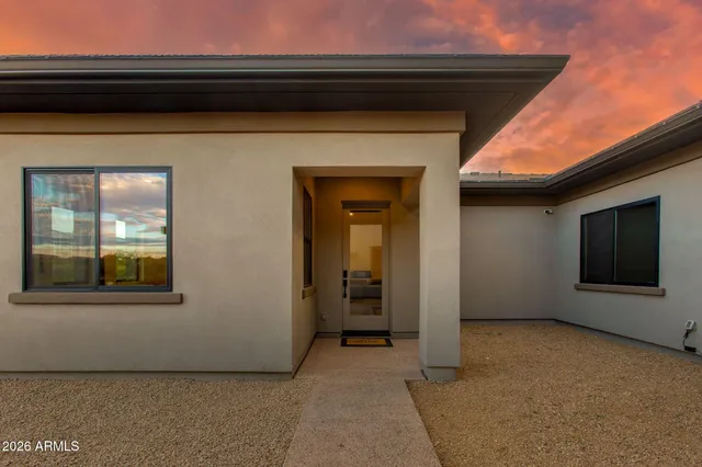 a kitchen with stainless steel appliances granite countertop a sink and a refrigerator