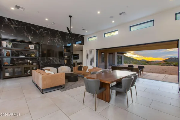 a kitchen with a table and chairs in it