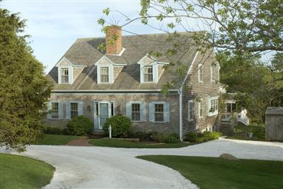 61 Shore Road Chatham, MA 02633 - Photo 1 of 28 a front view of a house with a garden