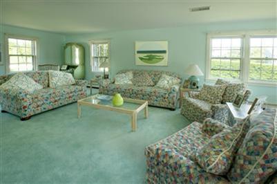 61 Shore Road Chatham, MA 02633 - Photo 12 of 28 a living room with furniture and a large window