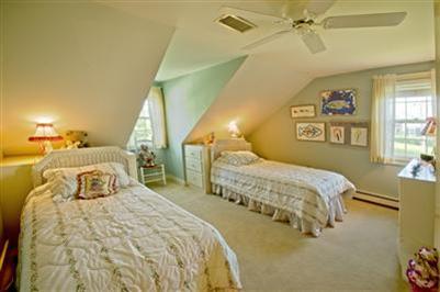 61 Shore Road Chatham, MA 02633 - Photo 18 of 28 a bedroom with two beds and painting on the wall