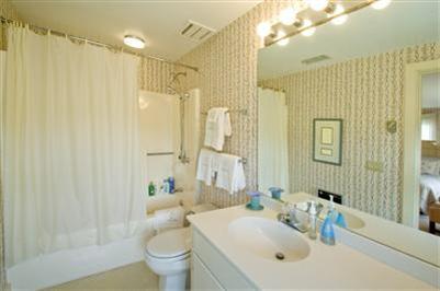 61 Shore Road Chatham, MA 02633 - Photo 20 of 28 a bathroom with a sink toilet and shower