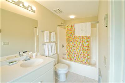 61 Shore Road Chatham, MA 02633 - Photo 22 of 28 a bathroom with a sink toilet and shower
