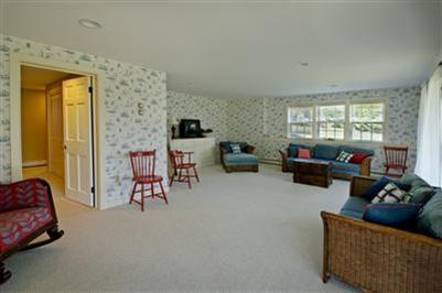 61 Shore Road Chatham, MA 02633 - Photo 27 of 28 a living room with furniture and a flat screen tv
