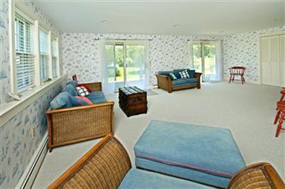 61 Shore Road Chatham, MA 02633 - Photo 28 of 28 a living room with furniture and large windows