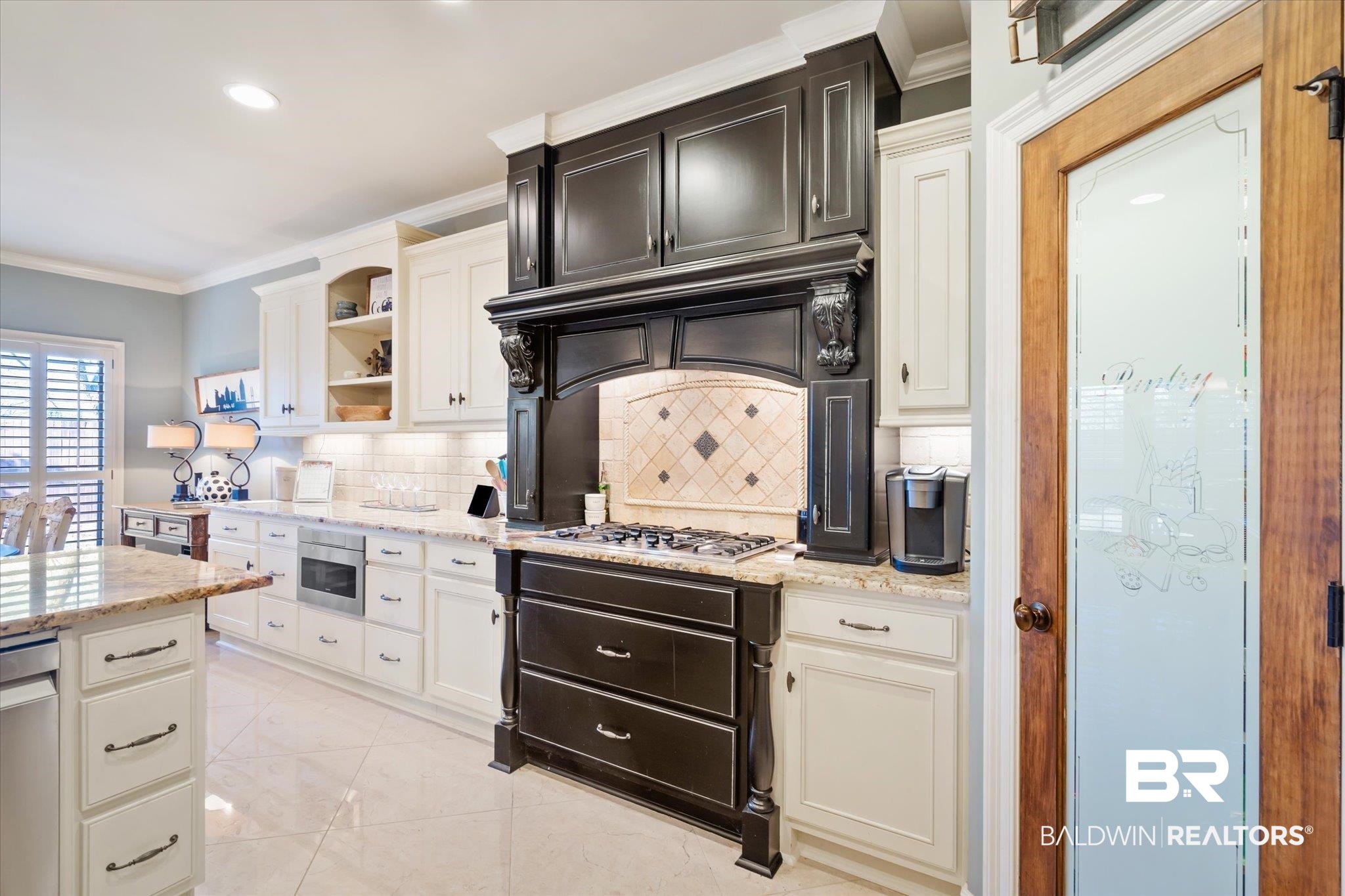 5683 Spring Landing Drive Theodore, AL 36582 - Photo 11 of 49 Kitchen with appliances with stainless steel finishes, decorative backsplash, light stone countertops, and ornamental molding