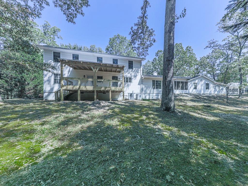633 Butterworth Road Canton, GA 30114 - Photo 46 of 55 a view of a house with backyard and sitting area