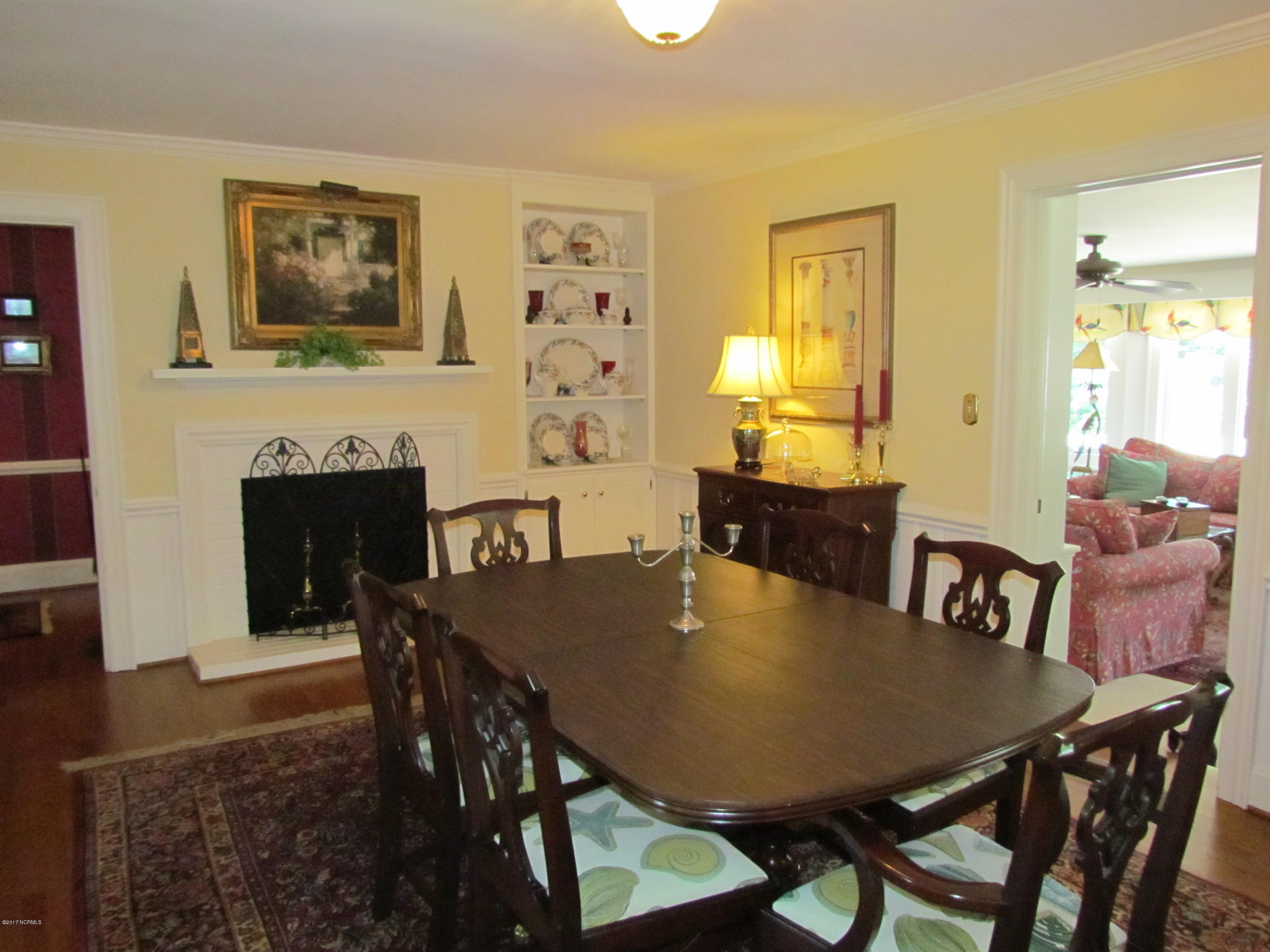 3216 Hawthorne Road Rocky Mount, NC 27804 - Photo 11 of 35 Great hardwood floors in the dining room, featuring 1 of 2 lovely fireplaces