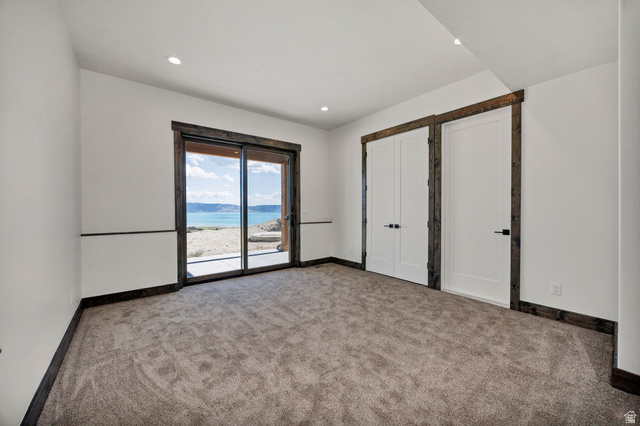 300 Knoll Loop, Unit 227 Fish Haven, ID 83287 - Photo 30 of 56 Unfurnished bedroom with carpet floors, access to outside, and recessed lighting