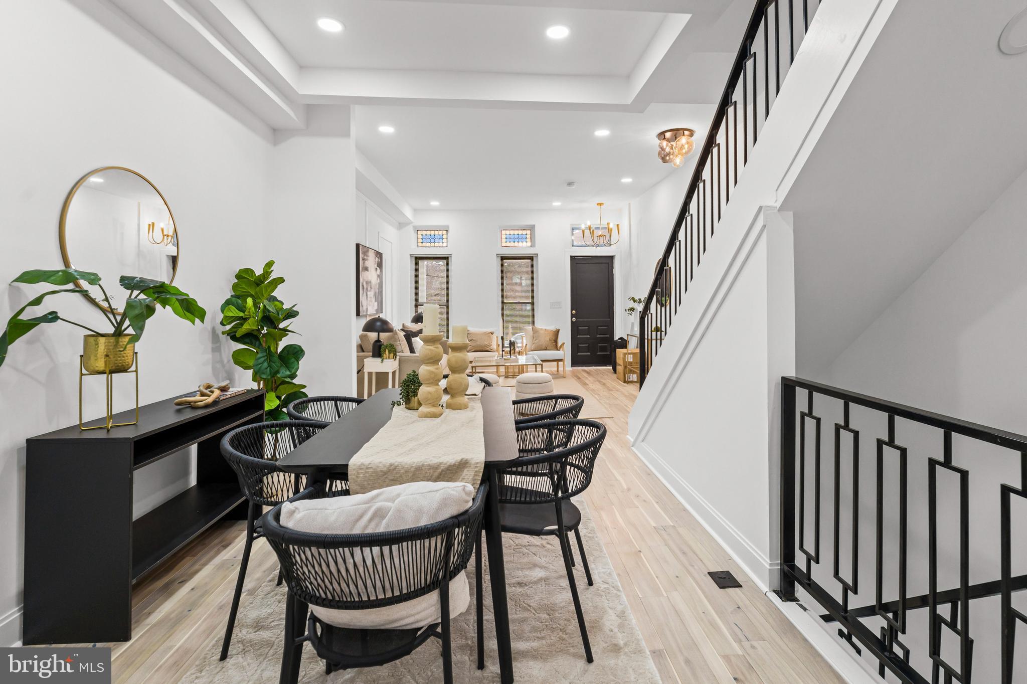 2321 Madison Avenue Baltimore, MD 21217 - Photo 13 of 55 a view of a livingroom with furniture staircase and a potted plant