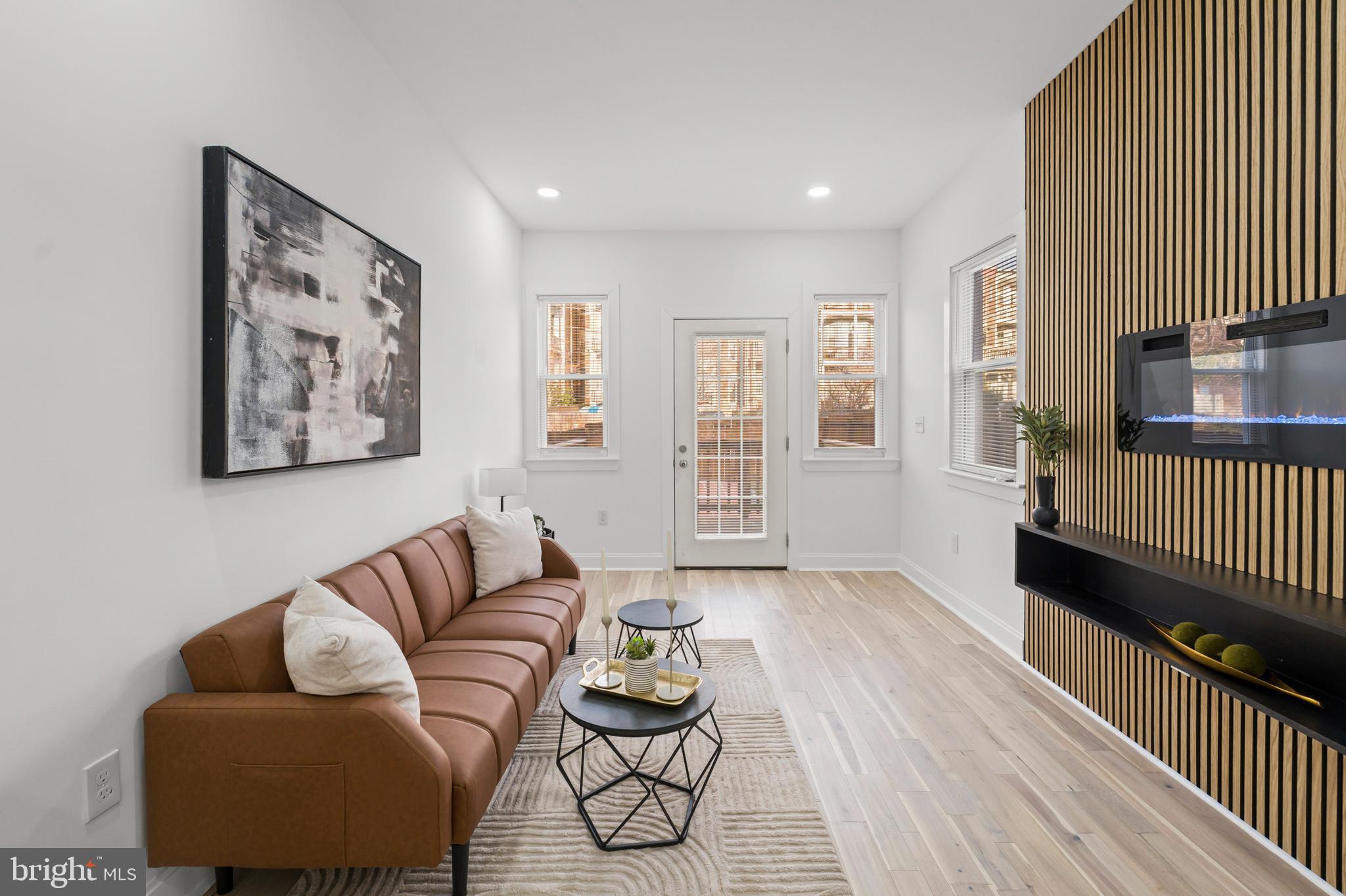 2321 Madison Avenue Baltimore, MD 21217 - Photo 18 of 55 a living room with furniture and wooden floor