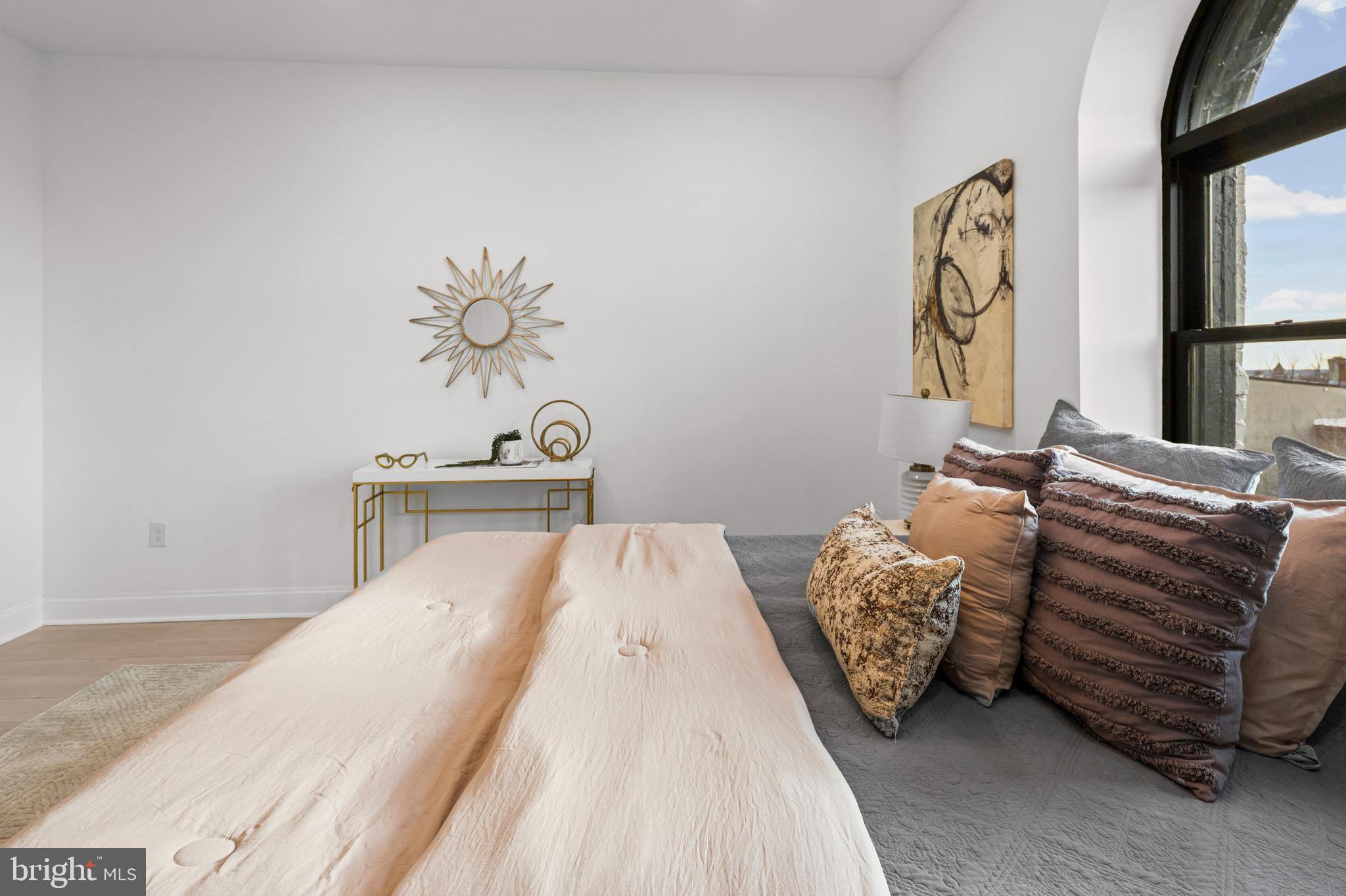 2321 Madison Avenue Baltimore, MD 21217 - Photo 23 of 55 a bedroom with a bed and a painting on the wall