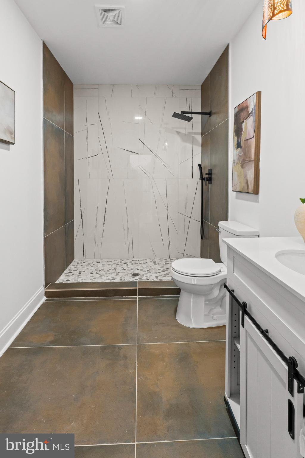 2321 Madison Avenue Baltimore, MD 21217 - Photo 24 of 55 a bathroom with a sink a toilet and a mirror
