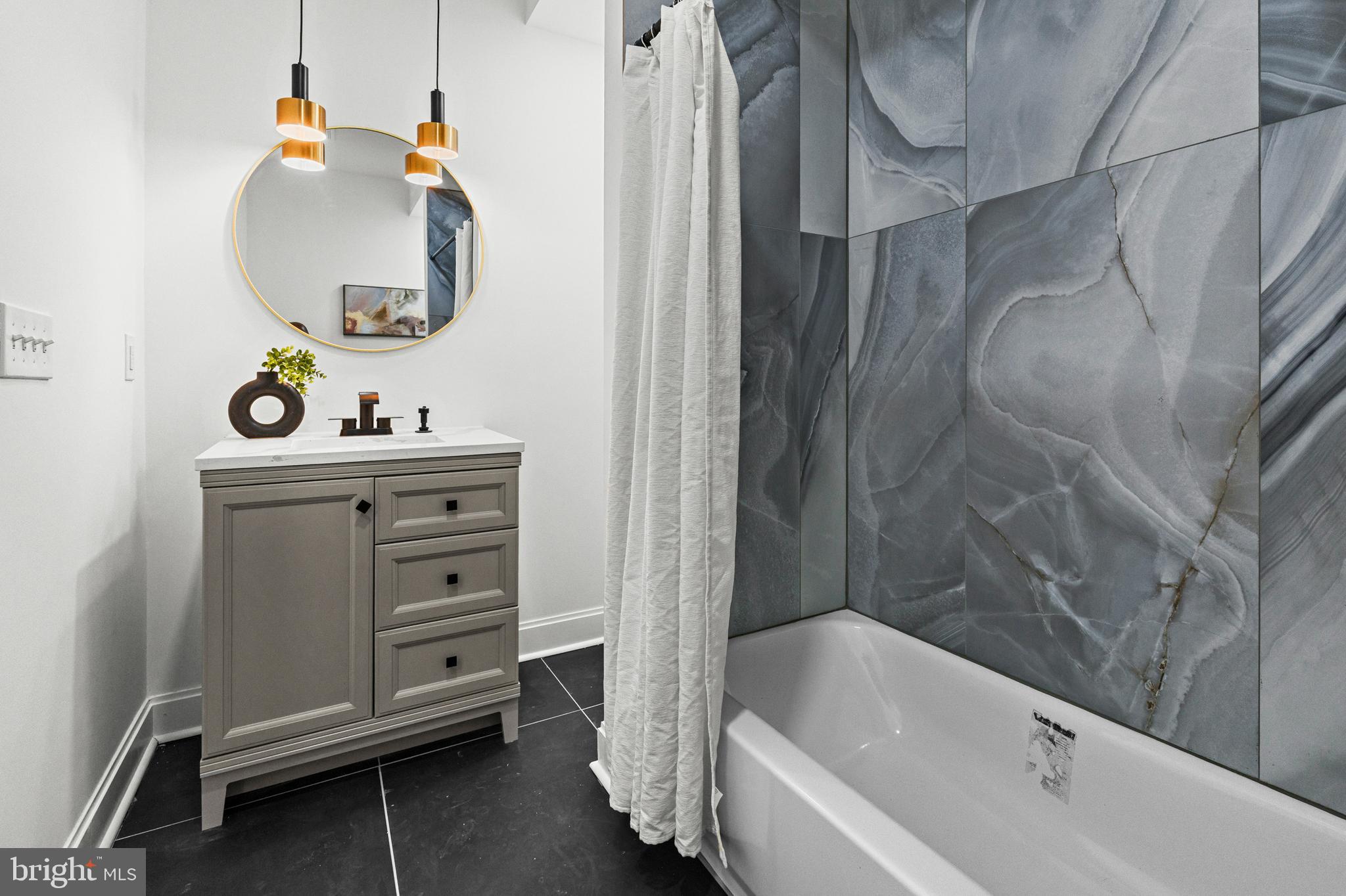 2321 Madison Avenue Baltimore, MD 21217 - Photo 30 of 55 a bathroom with a sink and a bathtub