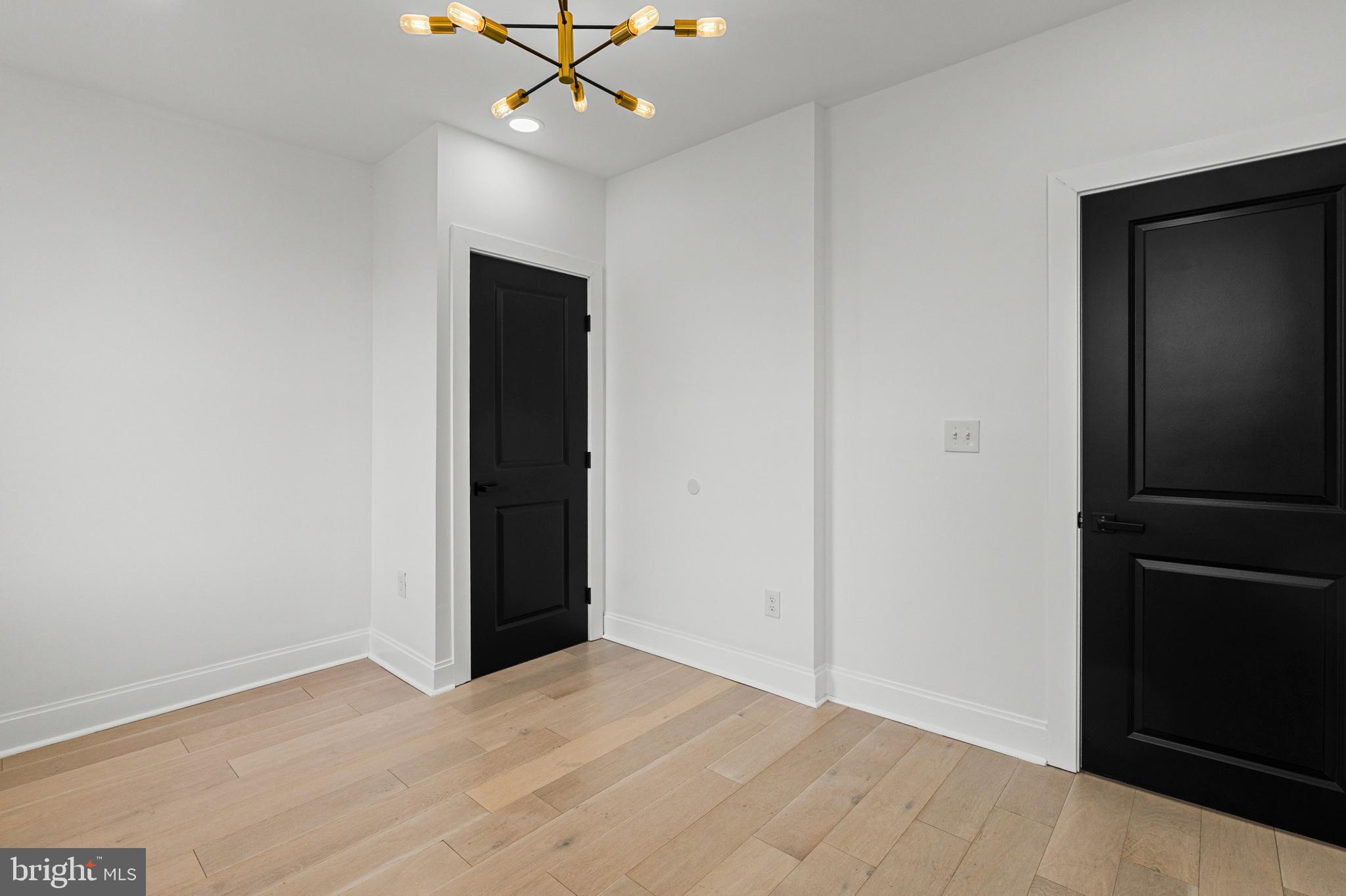 2321 Madison Avenue Baltimore, MD 21217 - Photo 36 of 55 an empty room with closet and a ceiling fan