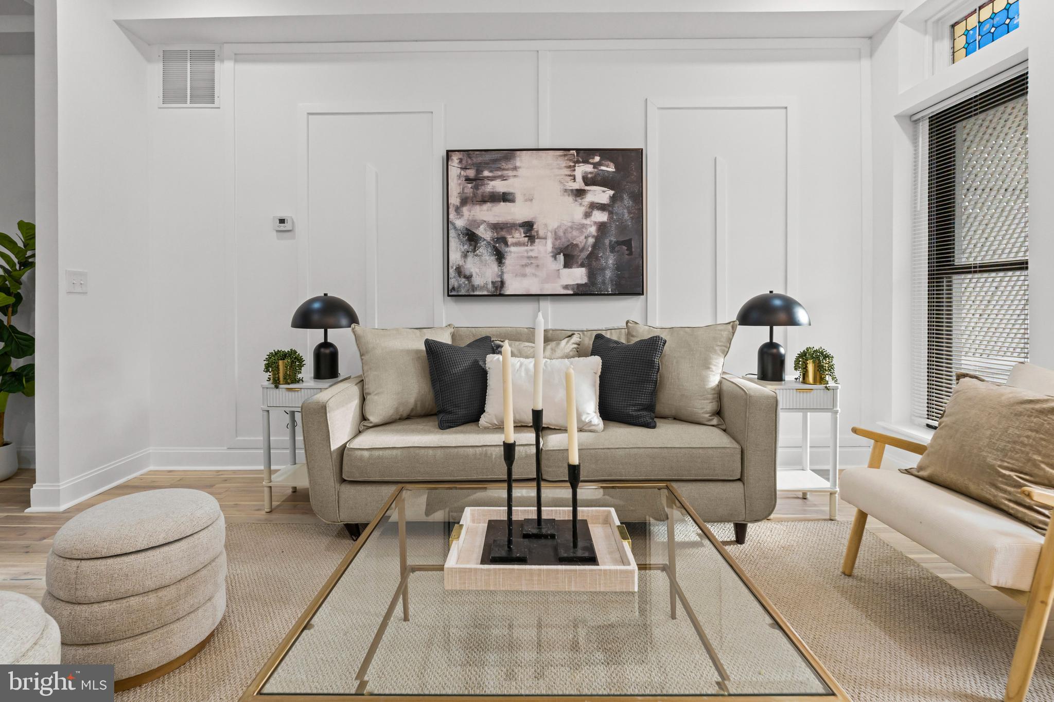 2321 Madison Avenue Baltimore, MD 21217 - Photo 4 of 55 a living room with furniture and a potted plant