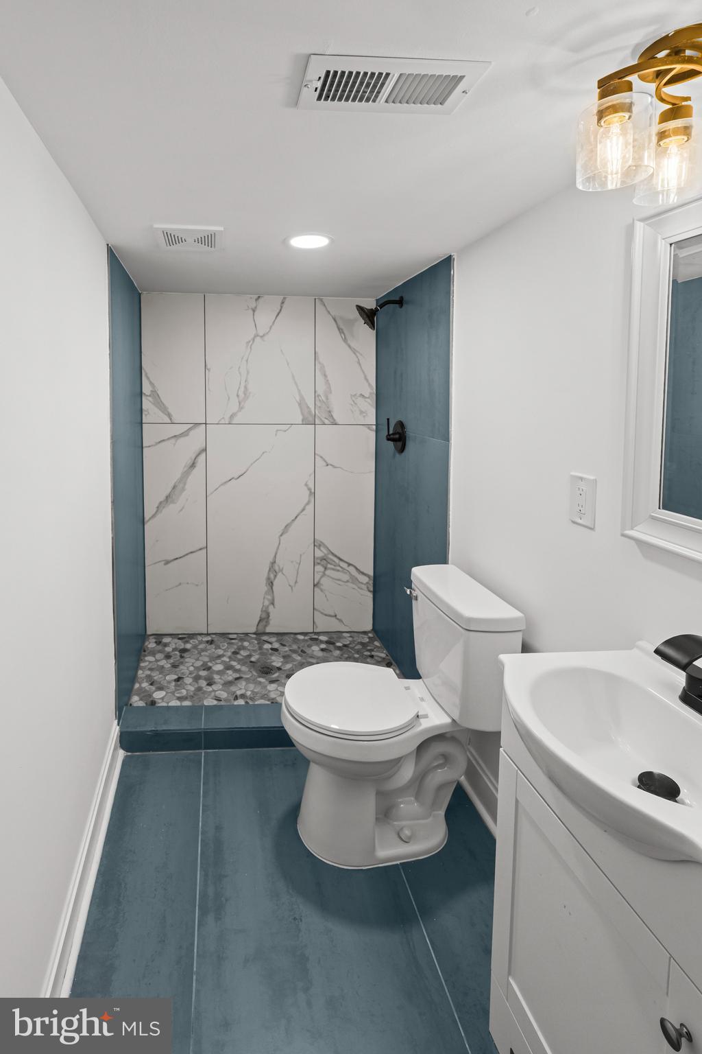 2321 Madison Avenue Baltimore, MD 21217 - Photo 42 of 55 a bathroom with a sink a toilet and shower