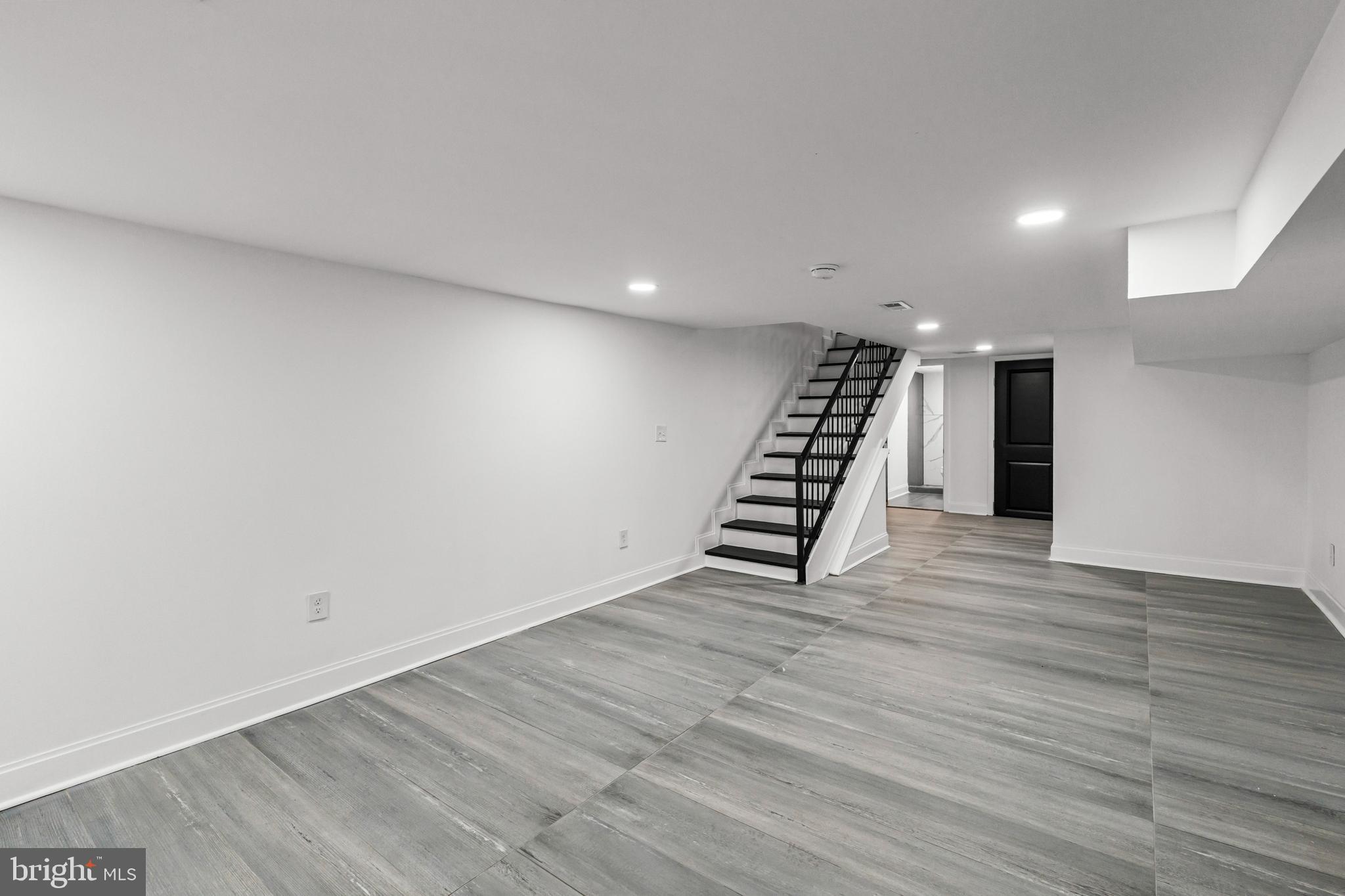 2321 Madison Avenue Baltimore, MD 21217 - Photo 44 of 55 a view of an empty room with wooden floor and entryway