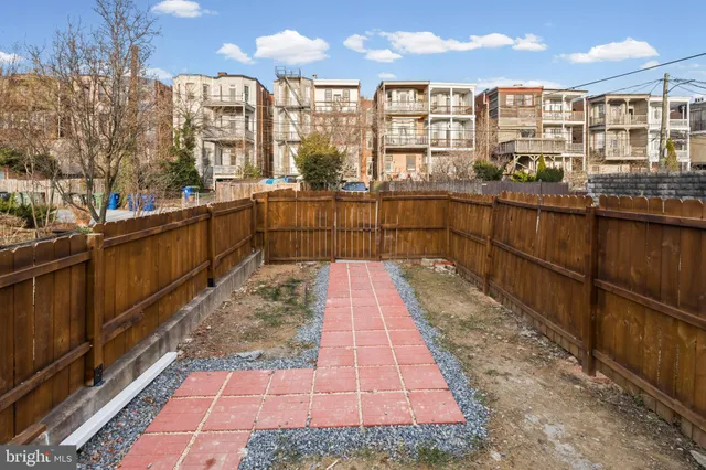 a kitchen with a refrigerator and window