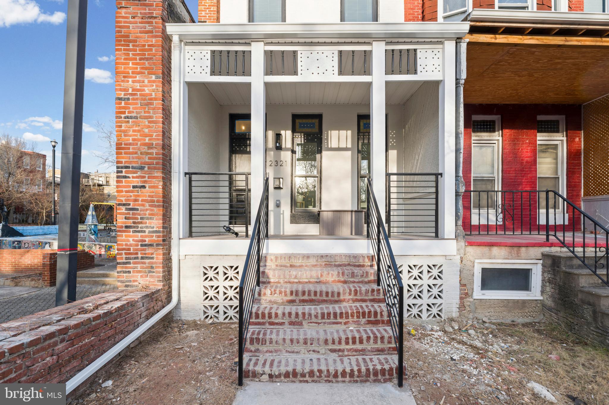 2321 Madison Avenue Baltimore, MD 21217 - Photo 52 of 55 a front view of a house with a porch