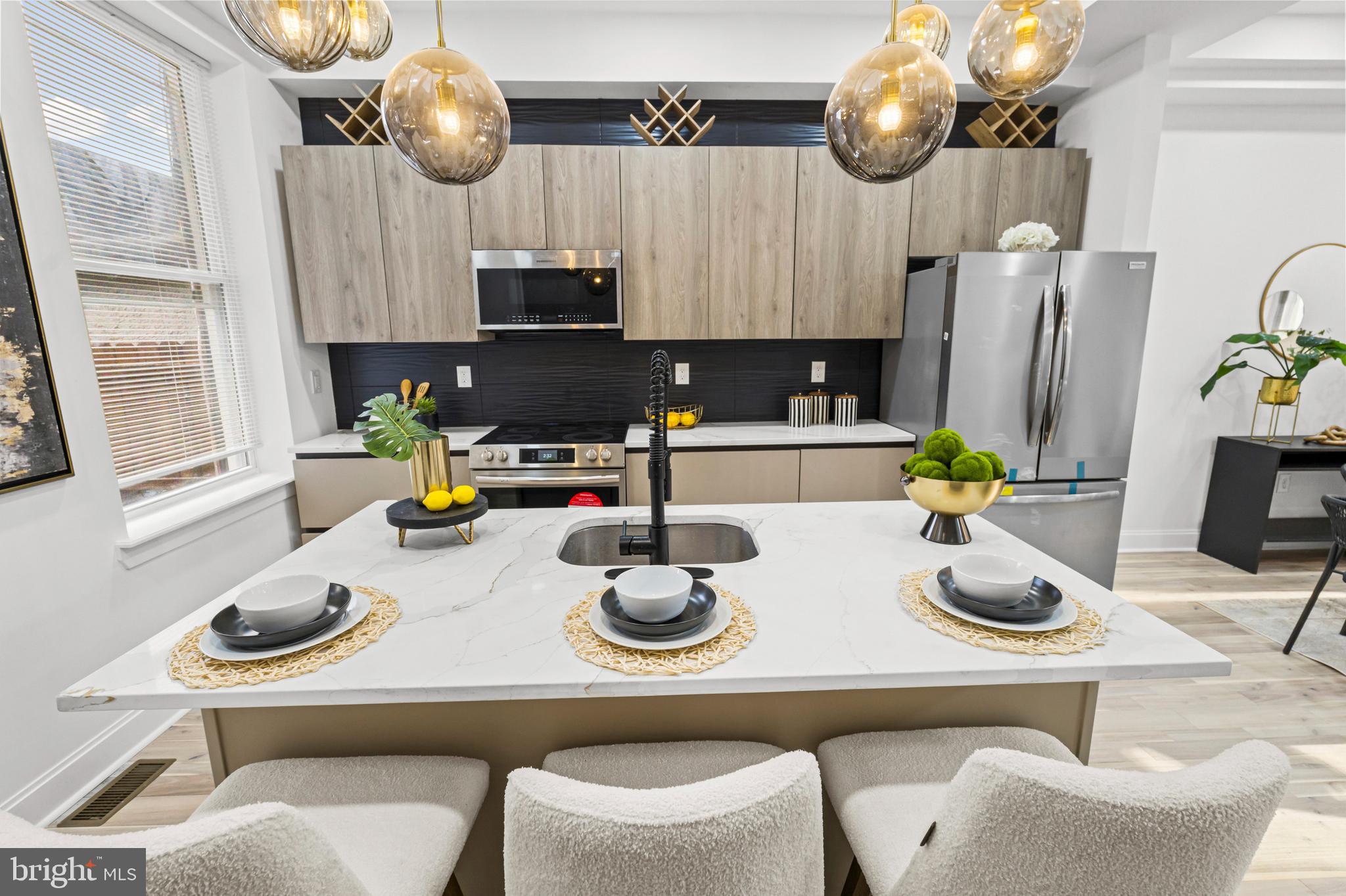 2321 Madison Avenue Baltimore, MD 21217 - Photo 8 of 55 a kitchen with a table and chairs