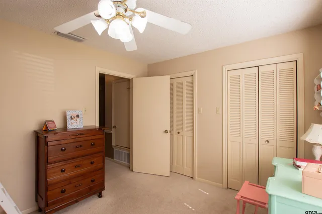 a view of a bedroom with a dresser