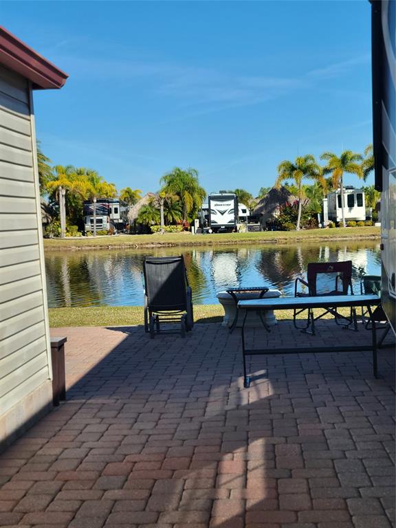 551 Southwest 42nd Cove Okeechobee, FL 34974 - Photo 11 of 25 a view of a lake with outdoor seating