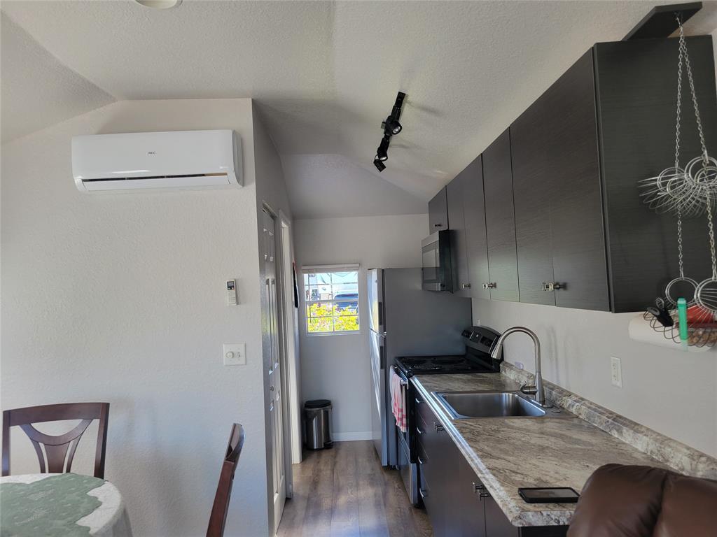 551 Southwest 42nd Cove Okeechobee, FL 34974 - Photo 20 of 25 a kitchen with stainless steel appliances granite countertop a sink stove and refrigerator