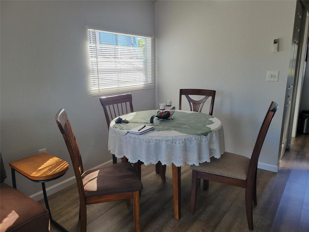 551 Southwest 42nd Cove Okeechobee, FL 34974 - Photo 21 of 25 a view of a dining room with furniture and wooden floor
