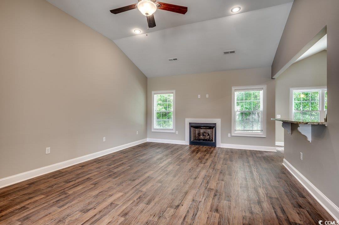 4076 Ridgewood Drive Conway, SC 29526 - Photo 15 of 32 Unfurnished living room with high vaulted ceiling,