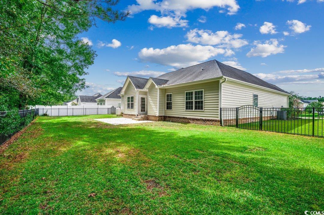 4076 Ridgewood Drive Conway, SC 29526 - Photo 27 of 32 Back of property with a yard and a patio area