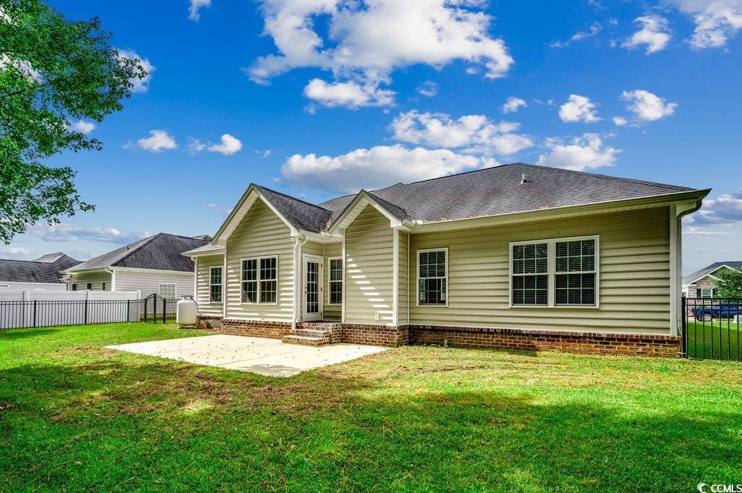 4076 Ridgewood Drive Conway, SC 29526 - Photo 28 of 32 Back of house featuring a lawn and a patio area