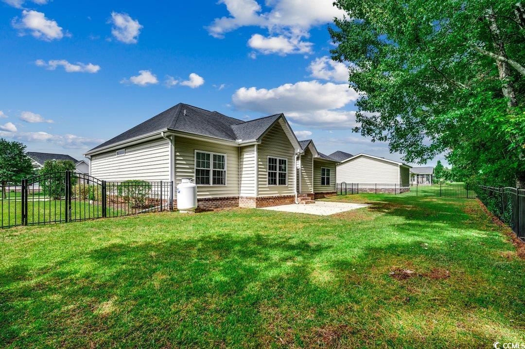 4076 Ridgewood Drive Conway, SC 29526 - Photo 29 of 32 Back of property with a yard and a patio area