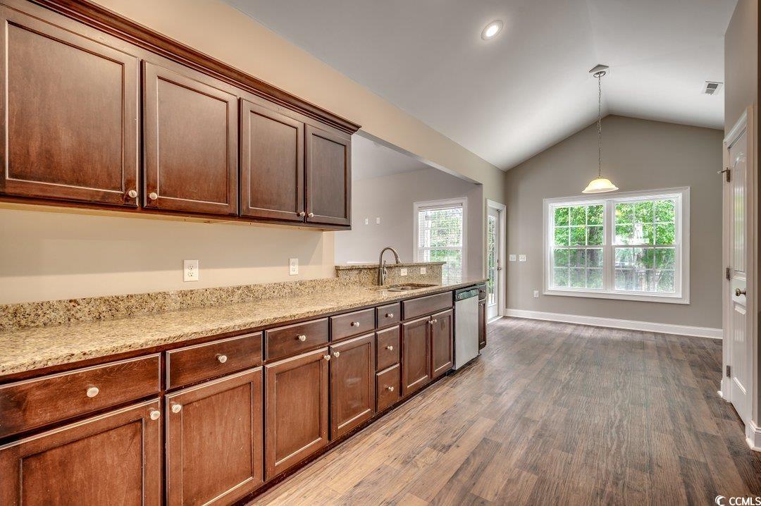 4076 Ridgewood Drive Conway, SC 29526 - Photo 6 of 32 Kitchen with vaulted ceiling, light stone counters