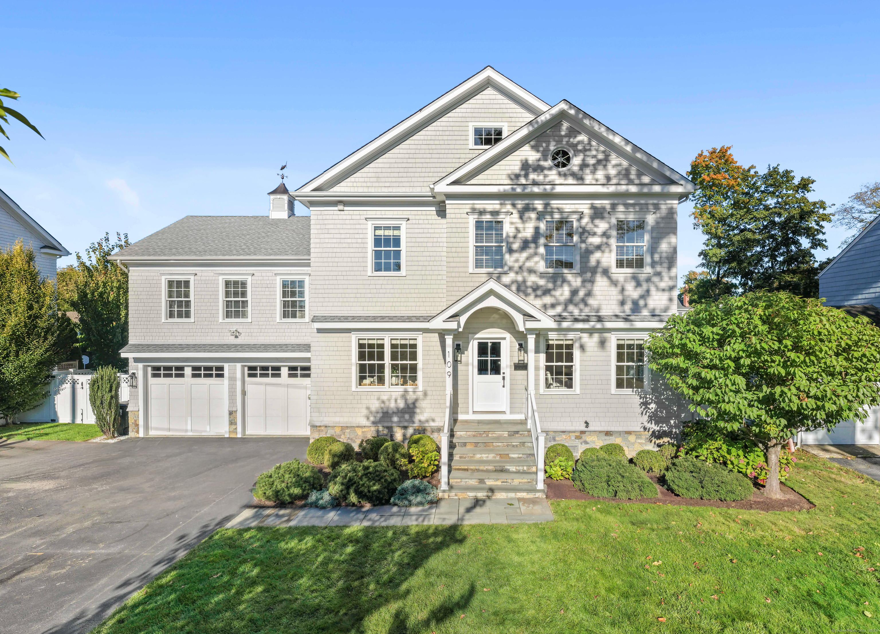 front view of a house with a yard
