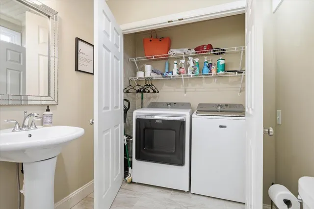 a kitchen with stainless steel appliances granite countertop a sink and a refrigerator