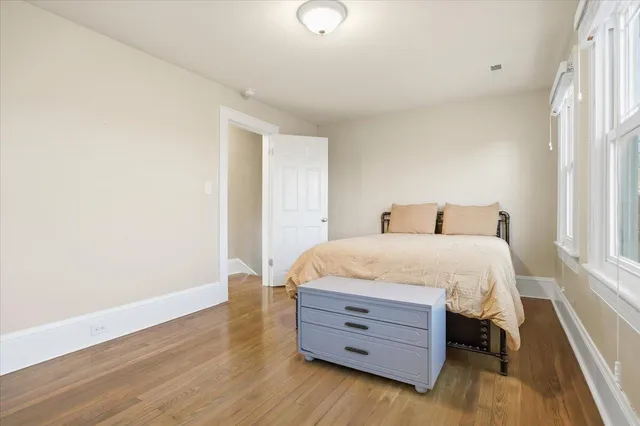 a bed room with a bed and a window