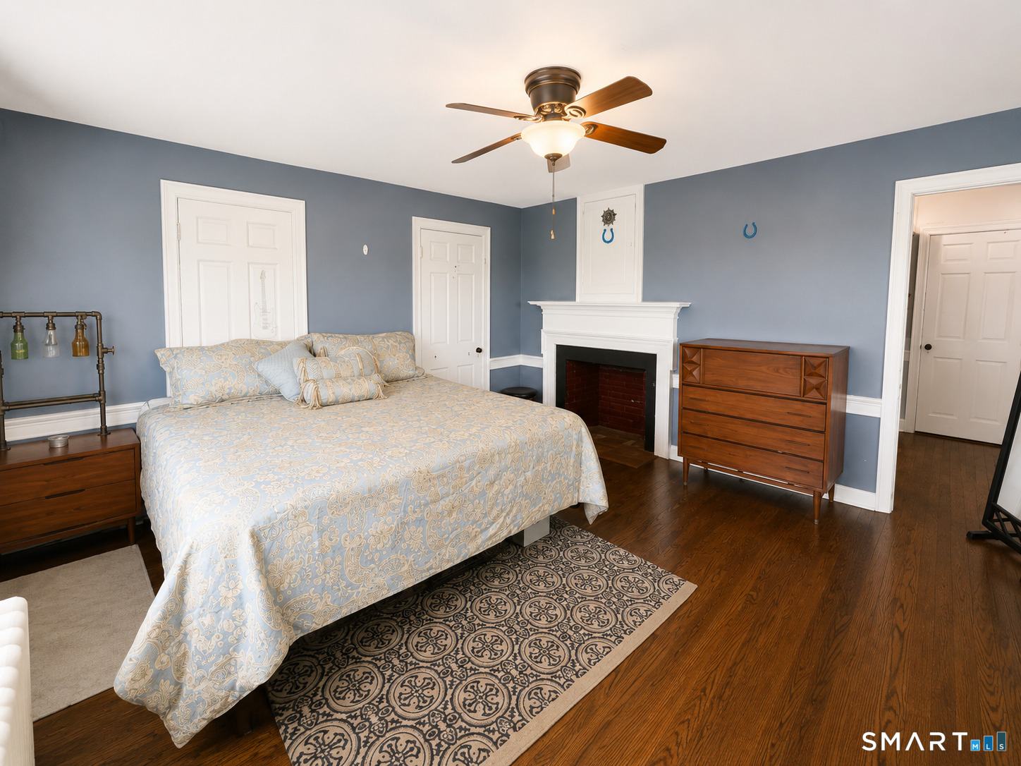 443 Amity Road Bethany, CT 06524 - Photo 17 of 30 a bedroom with a bed and a chandelier