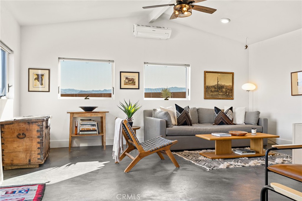 4212 Oneill Road Joshua Tree, CA 92252 - Photo 17 of 60 a living room with furniture a window and a table