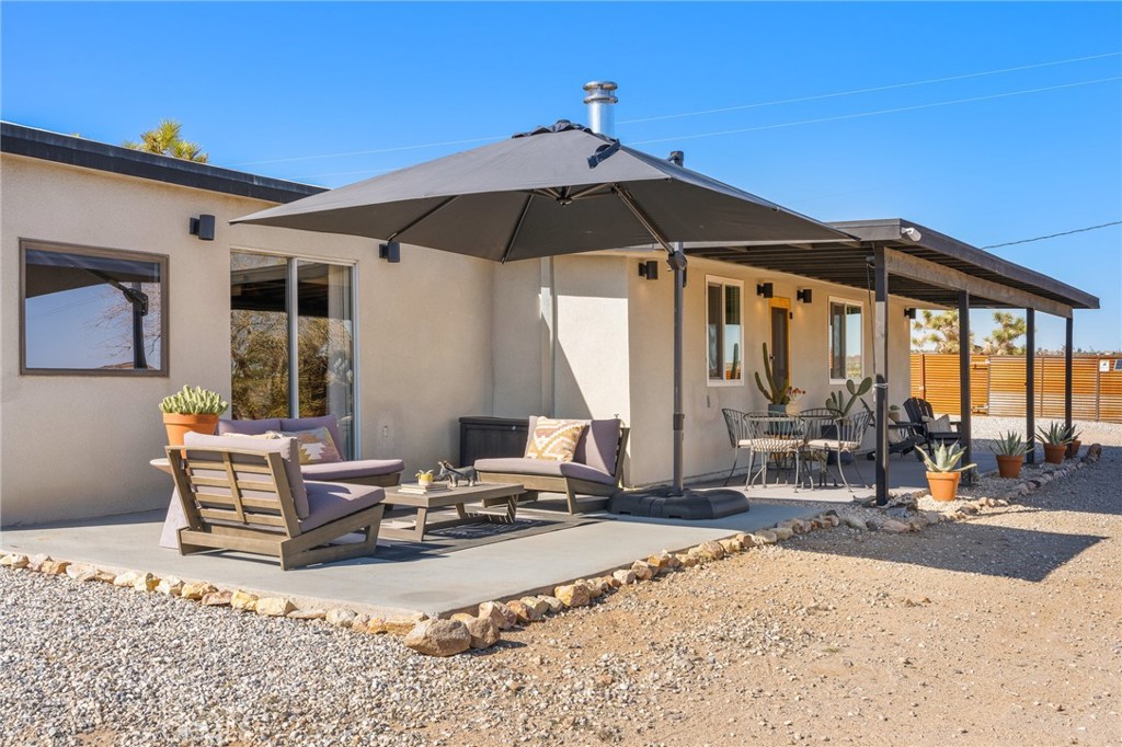 4212 Oneill Road Joshua Tree, CA 92252 - Photo 19 of 60 a view of a lounge chair in the patio