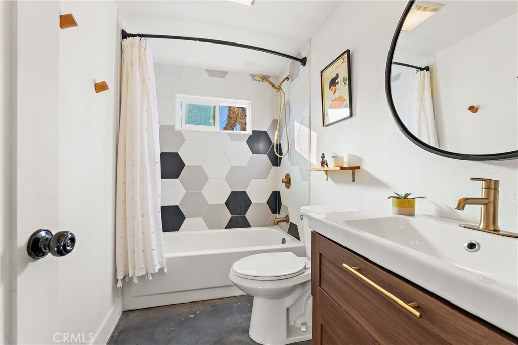 4212 Oneill Road Joshua Tree, CA 92252 - Photo 25 of 60 a bathroom with a sink a toilet and a mirror