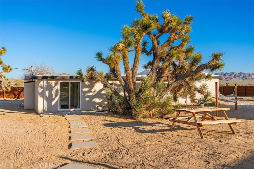4212 Oneill Road Joshua Tree, CA 92252 - Photo 28 of 60 a view of a yard with a tree